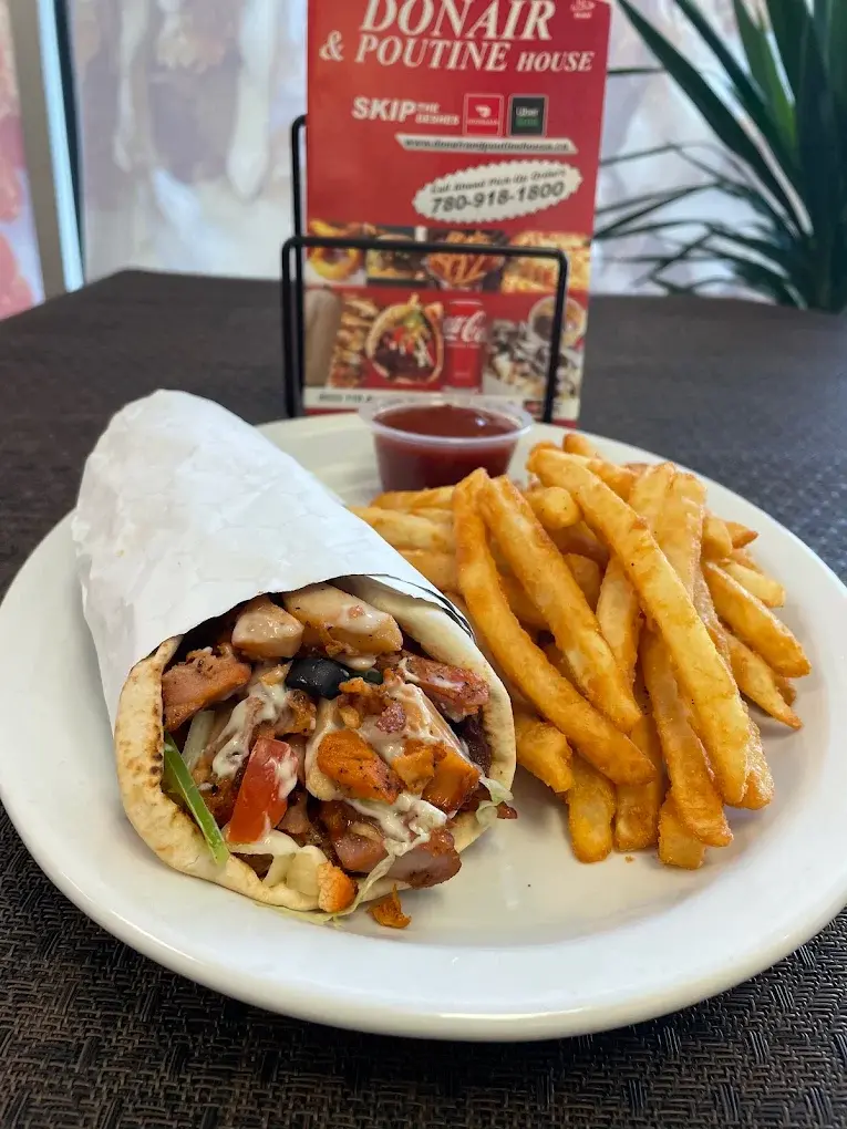 Chicken donair wrap with seasoned fries at Donair and Poutine House in Edmonton, AB